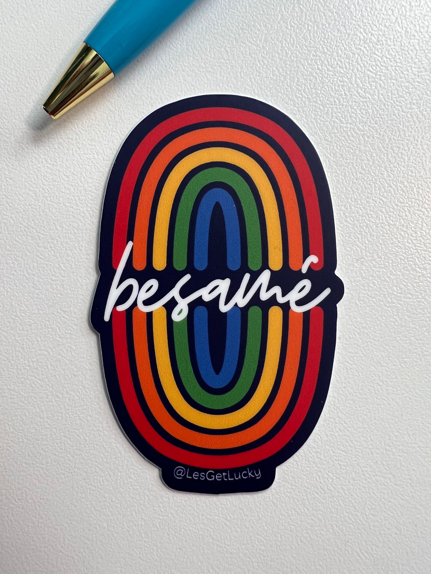 2" Vinyl Double Rainbow sticker, says "Besamé"